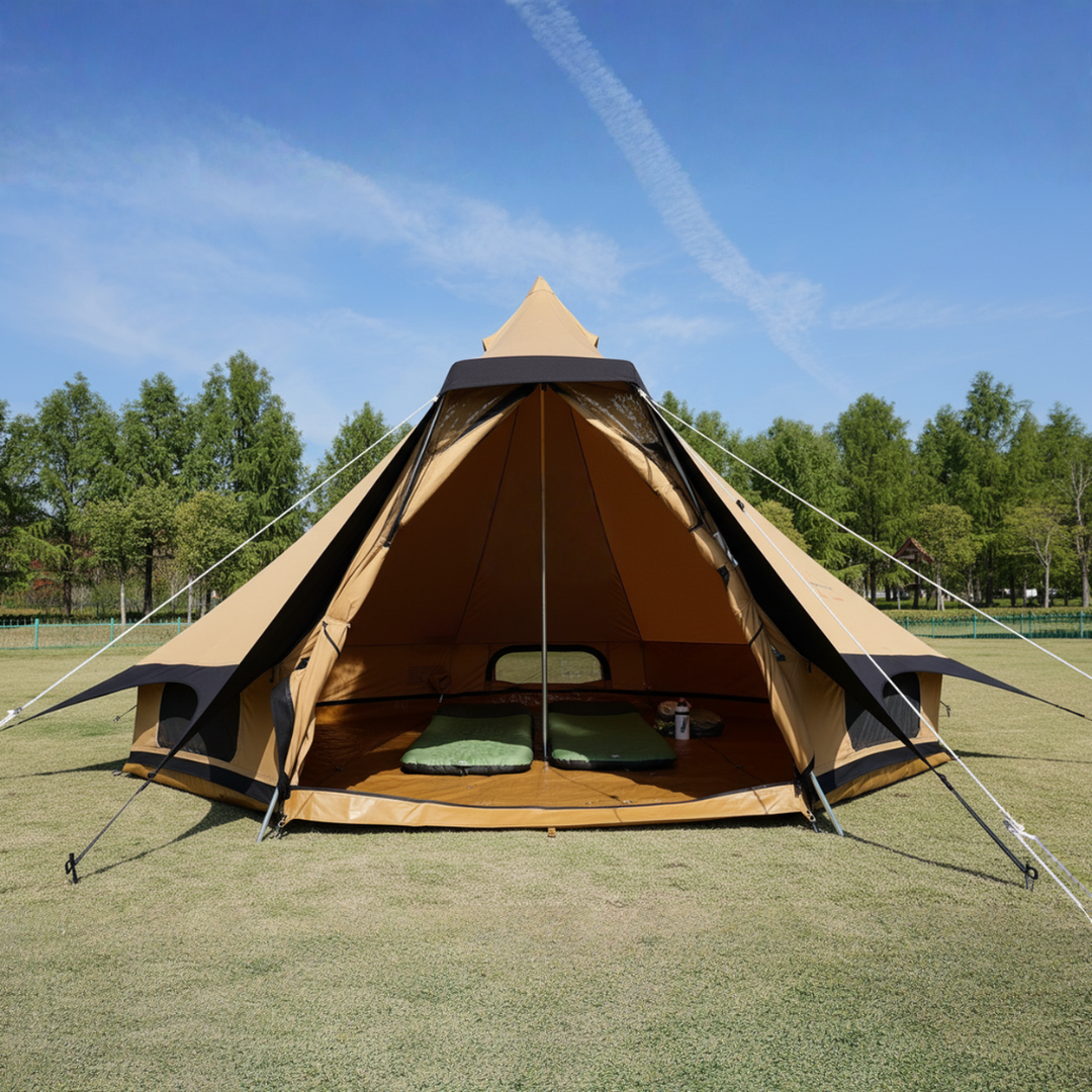 Aguja Glamping tent on grass with trees and blue sky in the background