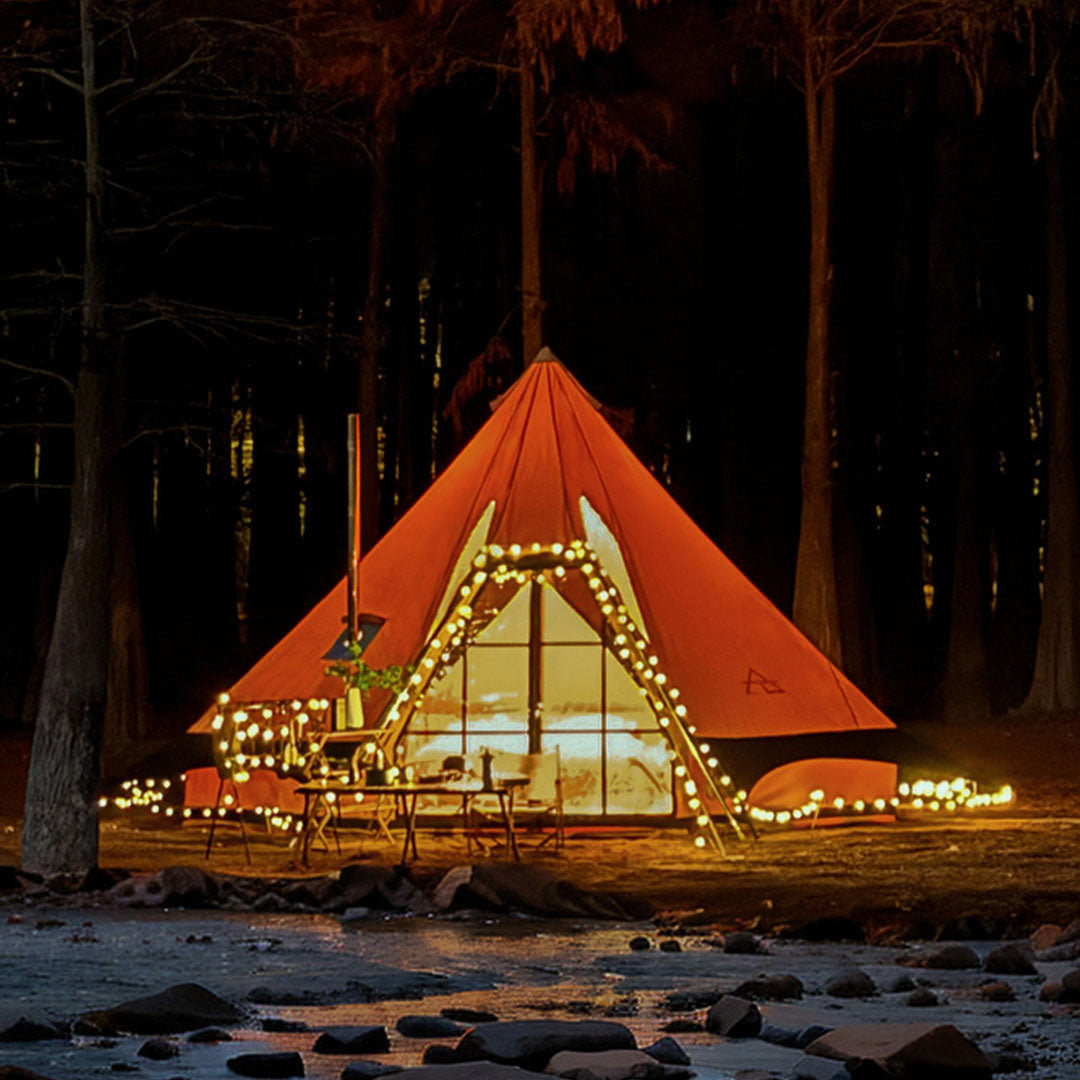 Festival camping — Aguja canvas tent at night
